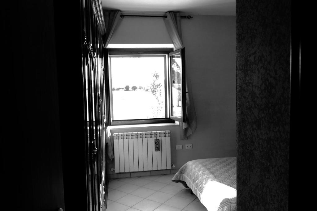 Łóżko lub łóżka w pokoju w obiekcie Parcoverdepino