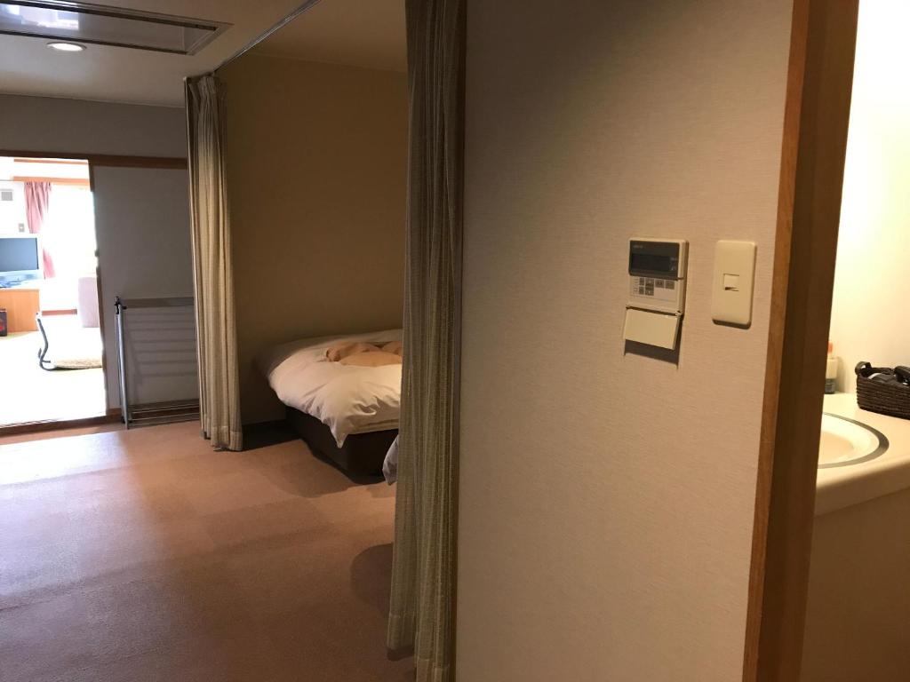 Postel nebo postele na pokoji v ubytování Hotel Higashidate