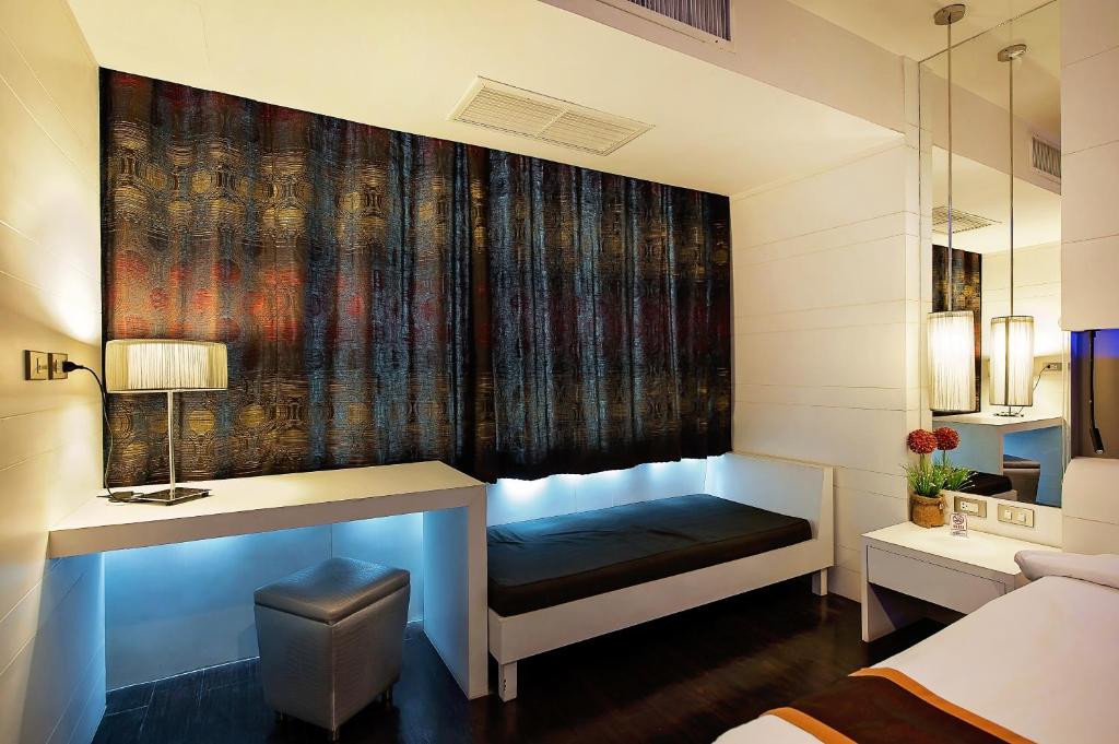 Postel nebo postele na pokoji v ubytování Khon Kaen Hotel