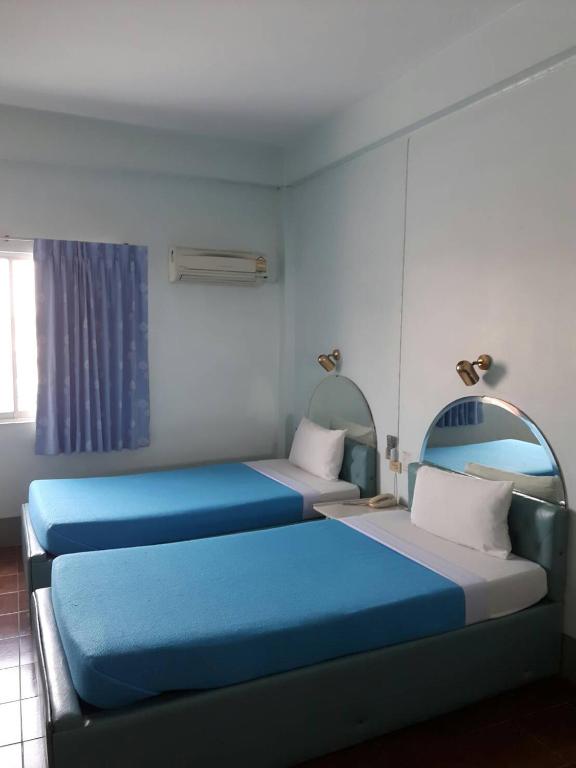 Postel nebo postele na pokoji v ubytování Anodard Hotel