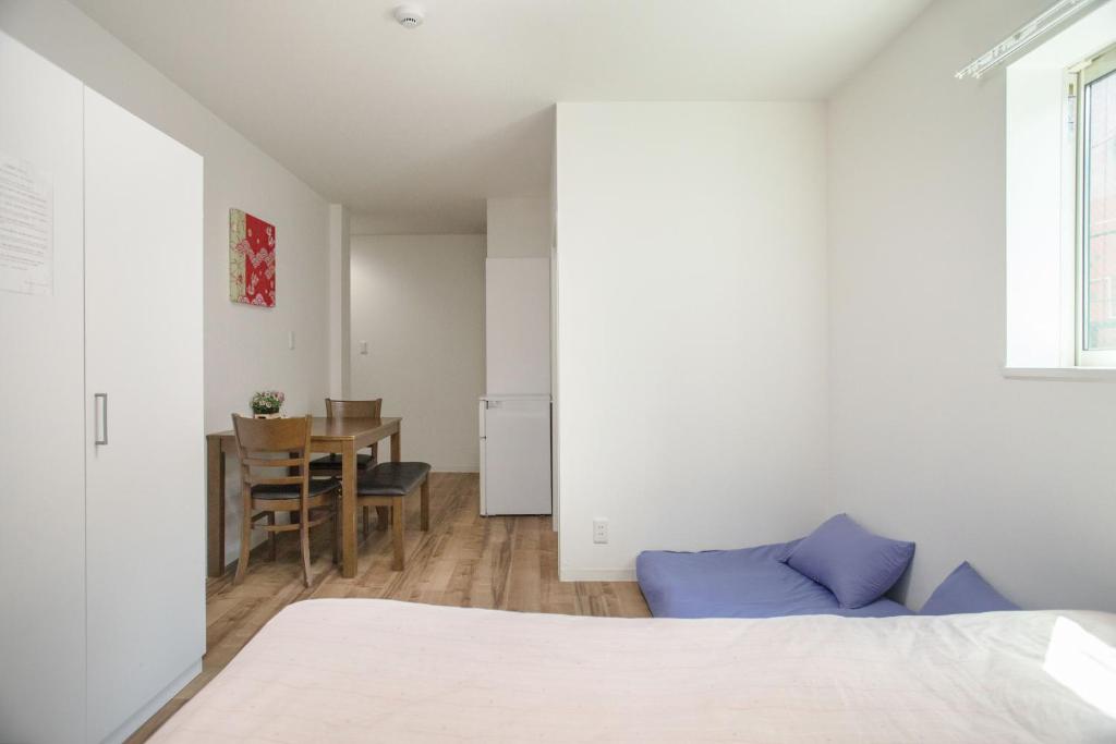 Postel nebo postele na pokoji v ubytování Osaka Tsuruhashitei Hotel Asahi group 大阪鶴橋亭ホテル
