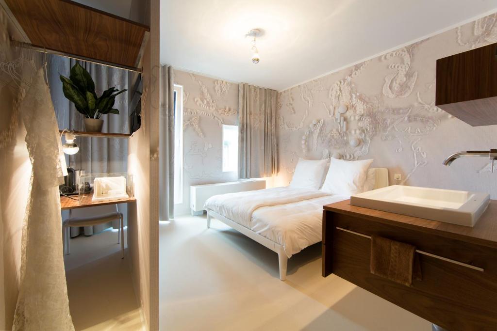 Postel nebo postele na pokoji v ubytování Design Hotel Modez