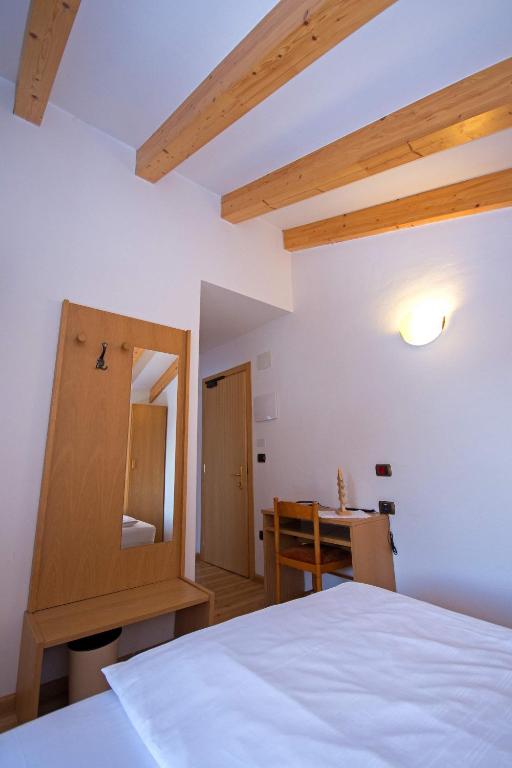 Postel nebo postele na pokoji v ubytování Hotel Miravalle