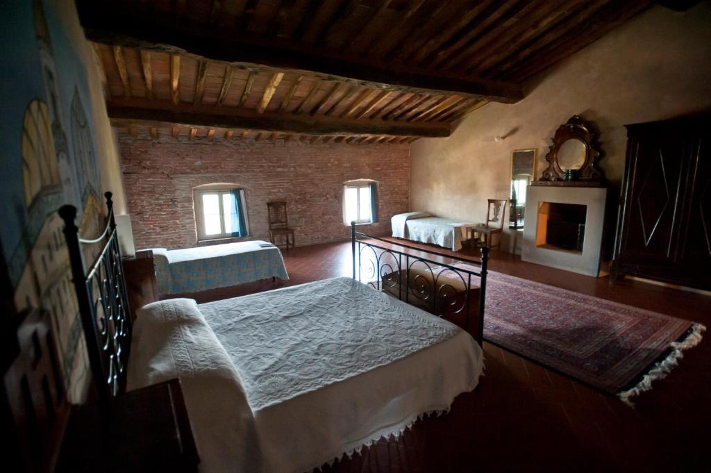 Postel nebo postele na pokoji v ubytování B&B Glicine e Luna