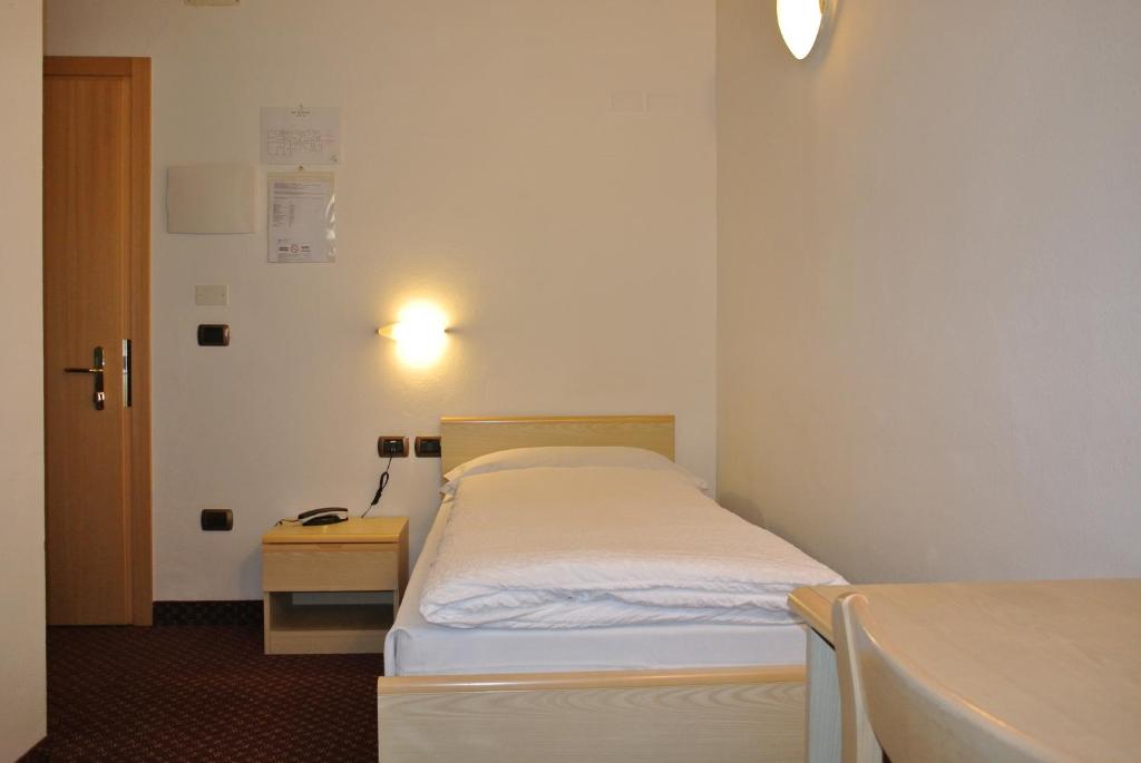 Postel nebo postele na pokoji v ubytování Hotel Miravalle