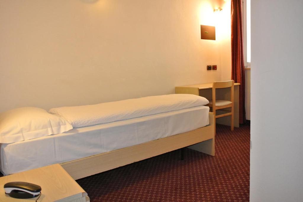 Postel nebo postele na pokoji v ubytování Hotel Miravalle