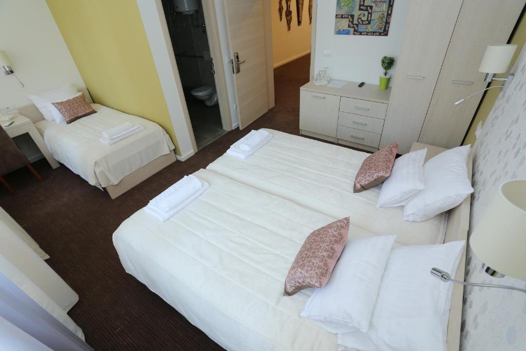 Postel nebo postele na pokoji v ubytování Konačište Grad B&B