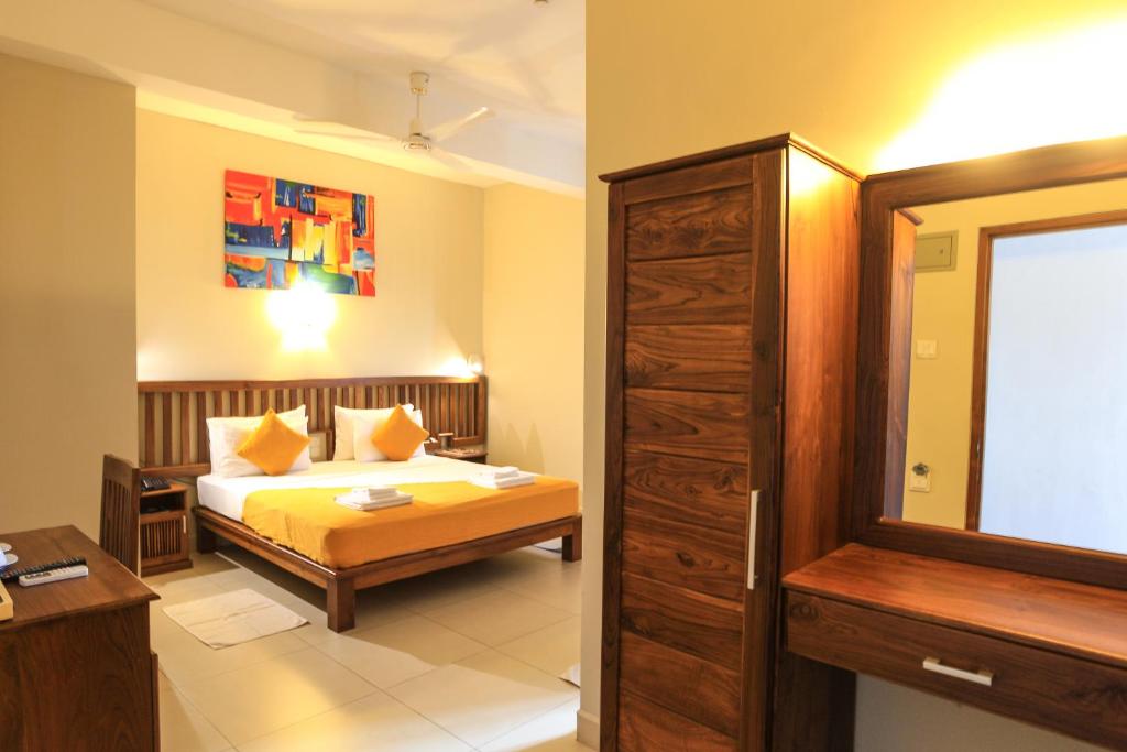 En eller flere senger på et rom på Port View City Hotel