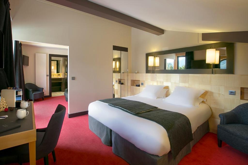 En eller flere senge i et værelse på Excelsior Chamonix Hôtel & Spa