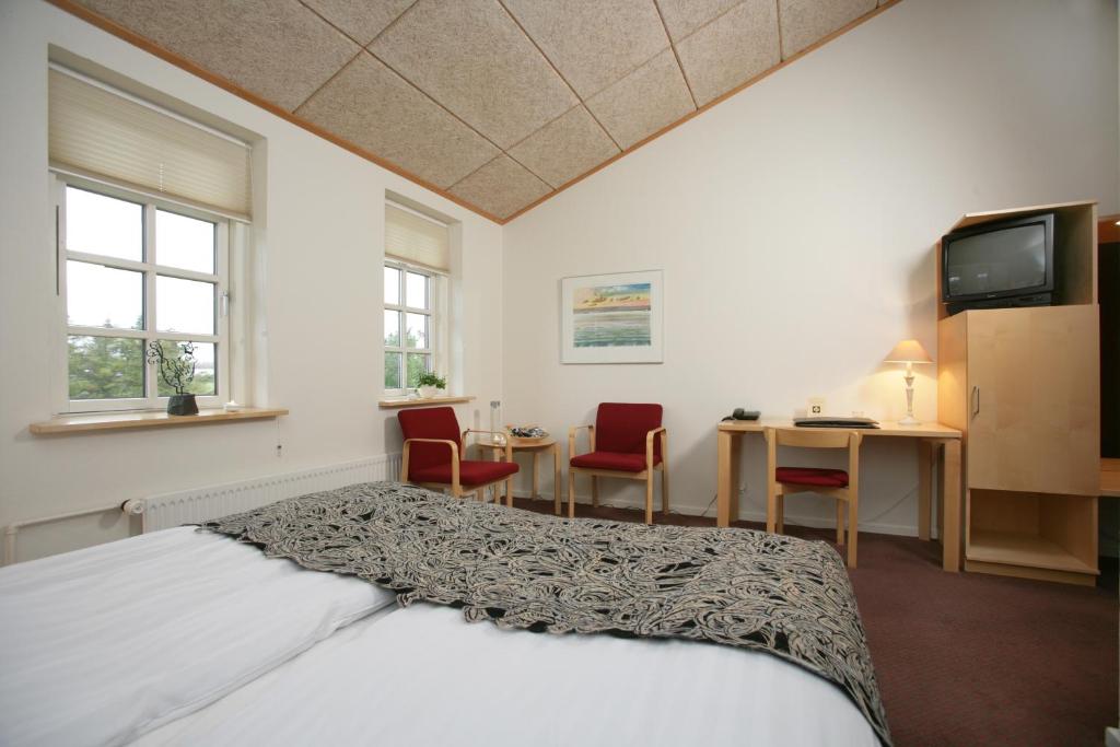 Postel nebo postele na pokoji v ubytování Vilcon Hotel & Konferencegaard