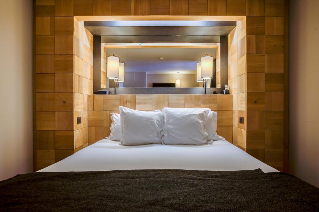 En eller flere senge i et værelse på Excelsior Chamonix Hôtel & Spa