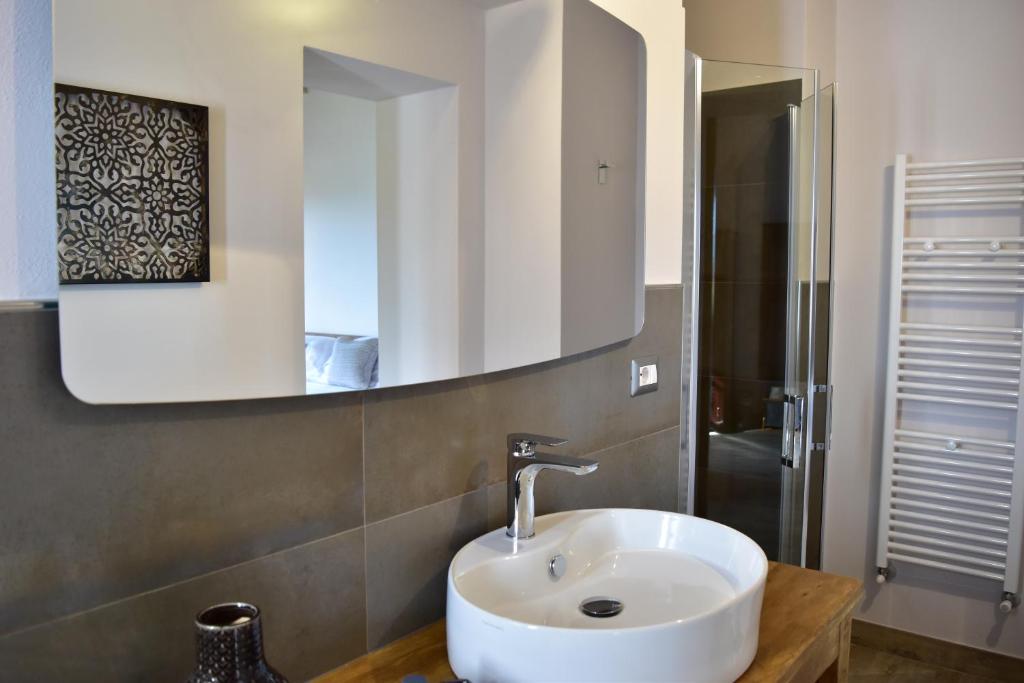 a bathroom with a sink and a mirror at Villa San Michele in Barberino di Val dʼElsa