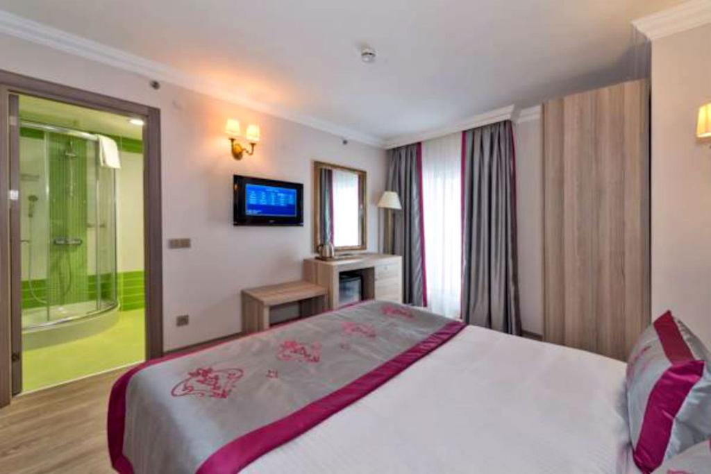 Postel nebo postele na pokoji v ubytování Dab Hotel