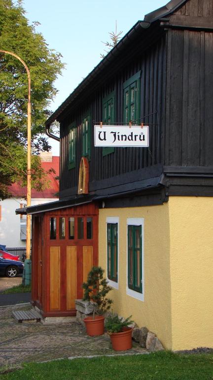 a building with a sign that reads c sindario at U Jindrů in Abertamy