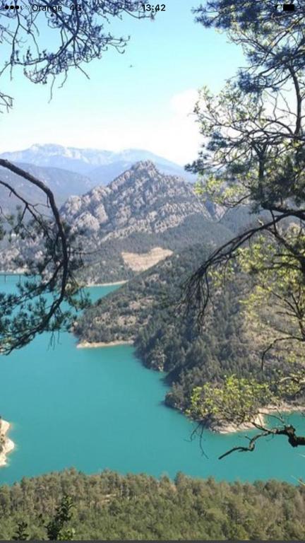 a view of a blue lake in the mountains at Ruralfranxuli in Avellanes