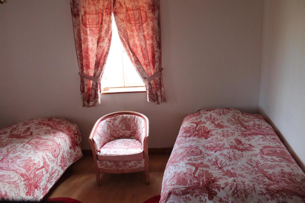 Postel nebo postele na pokoji v ubytování Manoir de la Queue Du Renard