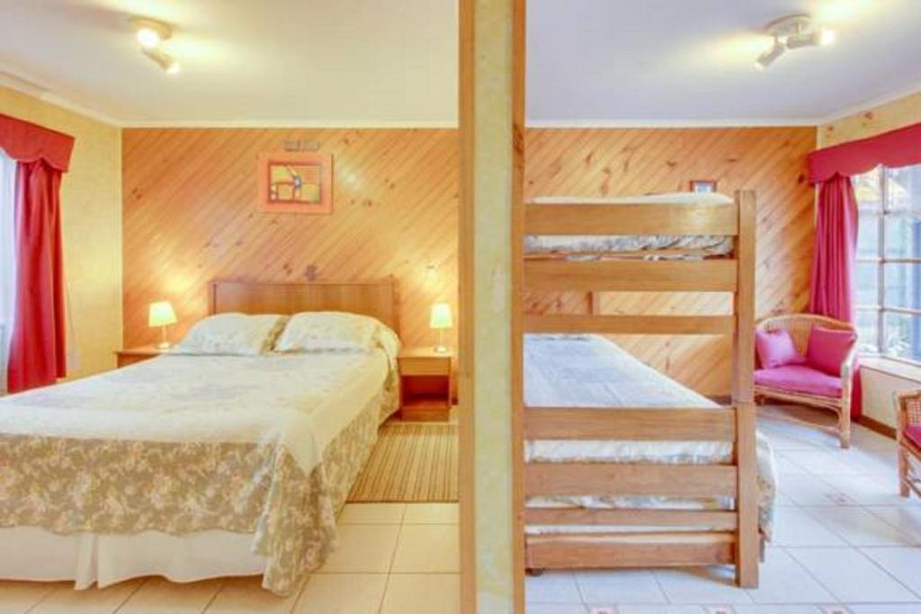 Voodi või voodid majutusasutuse Apart Hotel Blumenau toas