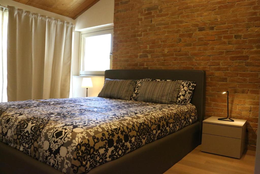 Postel nebo postele na pokoji v ubytování LA CASCINA DI CARLOTTA 1846 agriturismo