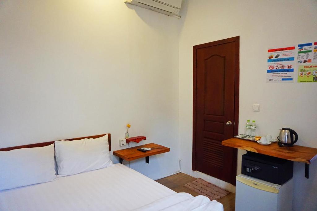Postel nebo postele na pokoji v ubytování Onederz Phnom Penh