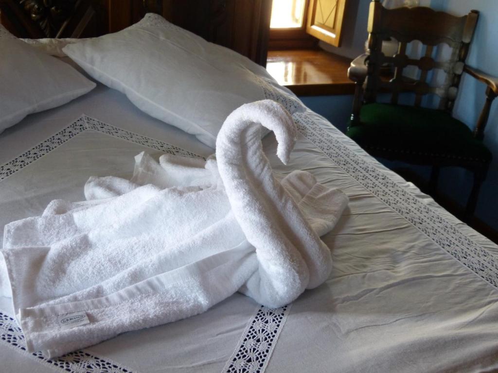 Postel nebo postele na pokoji v ubytování Ta Xelidonakia