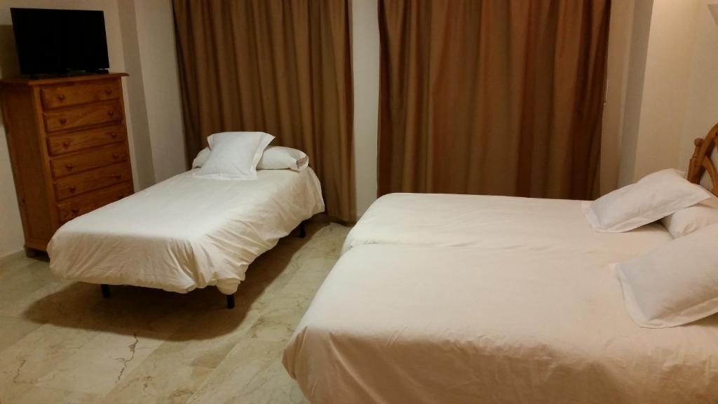 Postel nebo postele na pokoji v ubytování Hotel Balcón de Cazorla