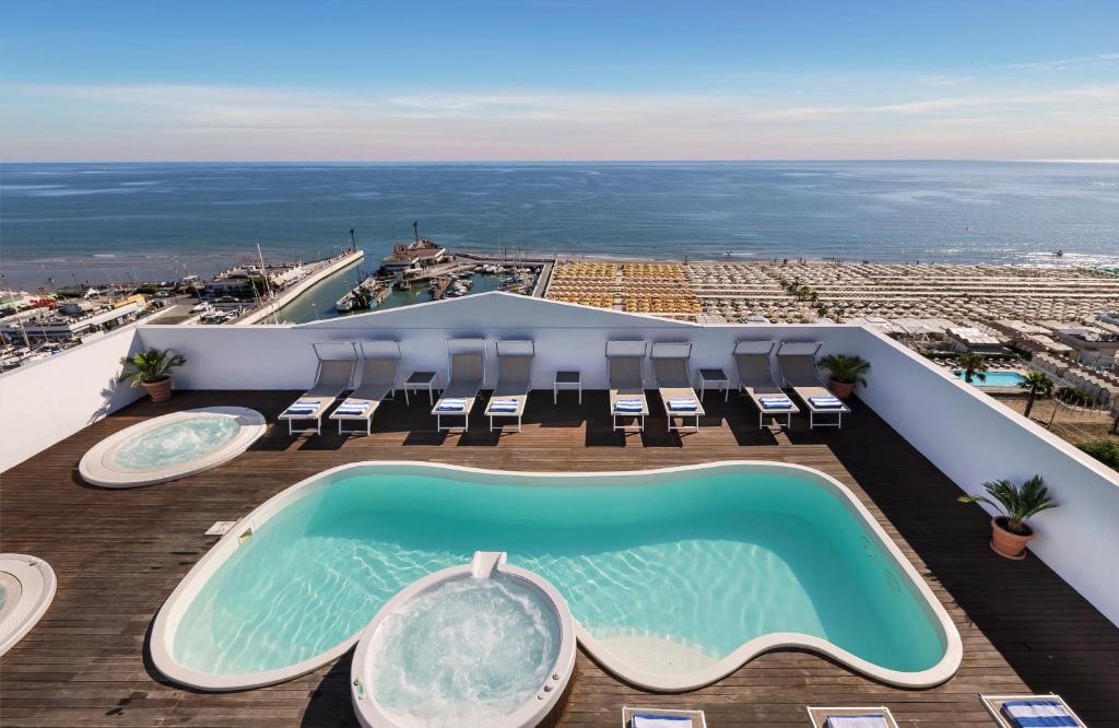 a swimming pool on the roof of a resort at Hotel Nautico in Riccione