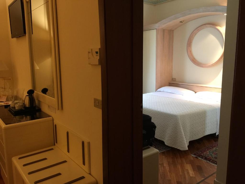 Postel nebo postele na pokoji v ubytování Grand Hotel Tettuccio