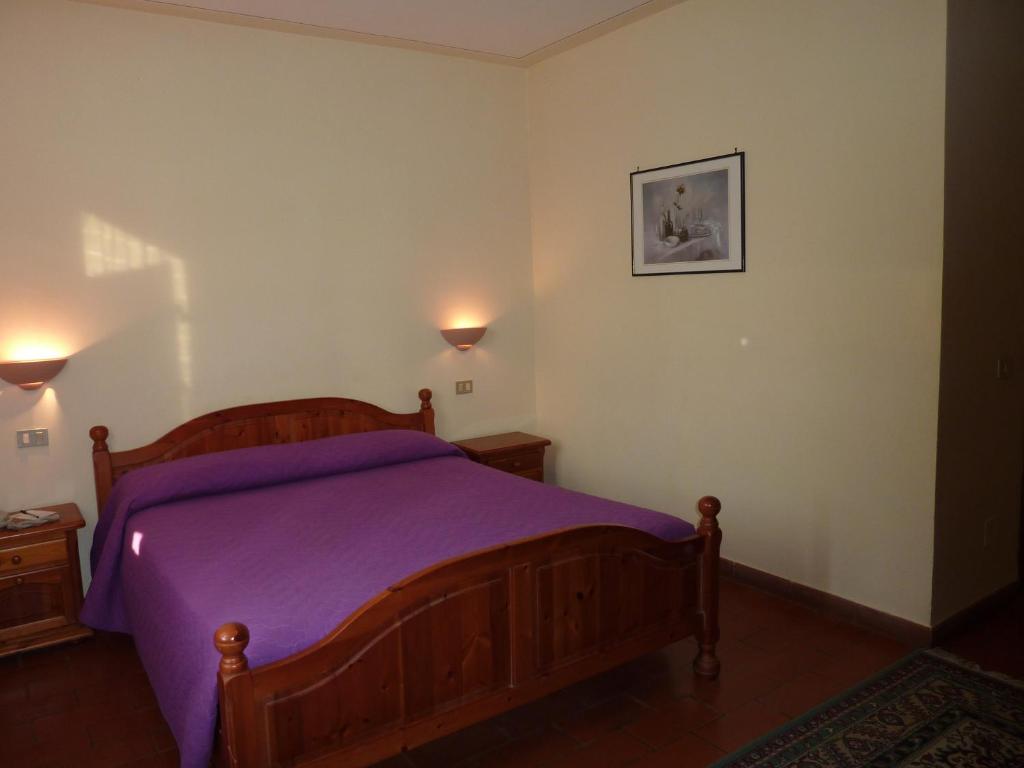 Postel nebo postele na pokoji v ubytování La Rocca
