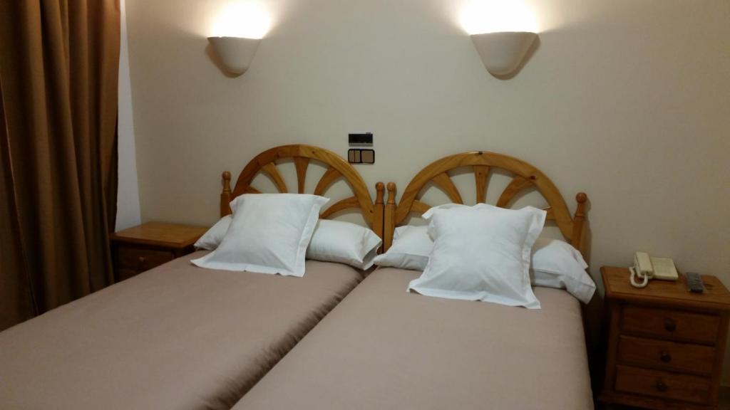 Postel nebo postele na pokoji v ubytování Hotel Balcón de Cazorla