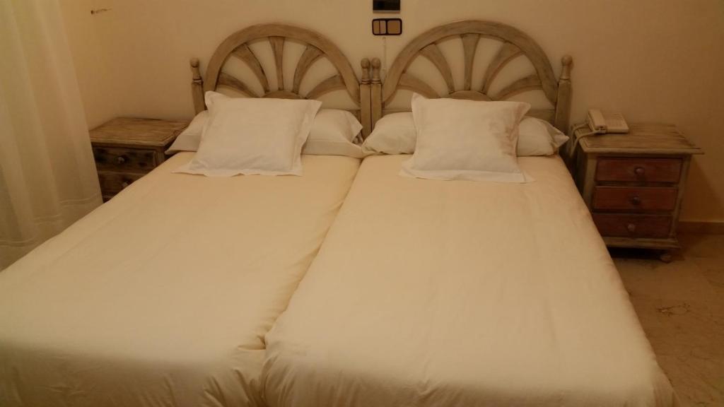 Postel nebo postele na pokoji v ubytování Hotel Balcón de Cazorla
