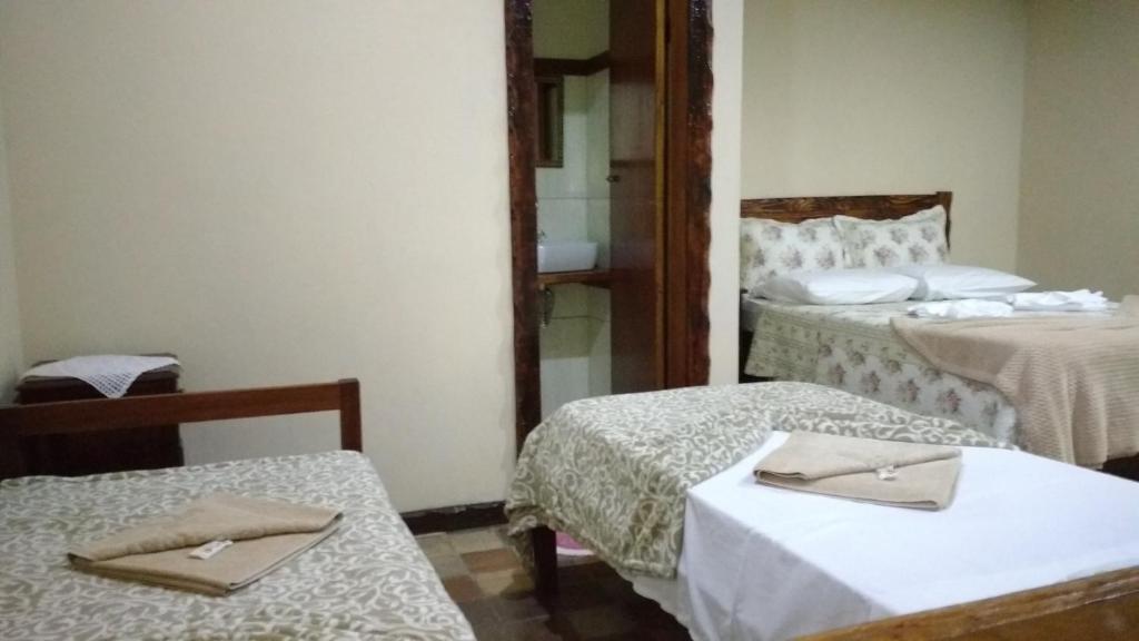 Postel nebo postele na pokoji v ubytování Pousada Aloes