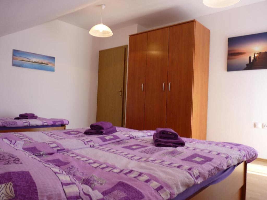 Posteľ alebo postele v izbe v ubytovaní Apartments Agrijan
