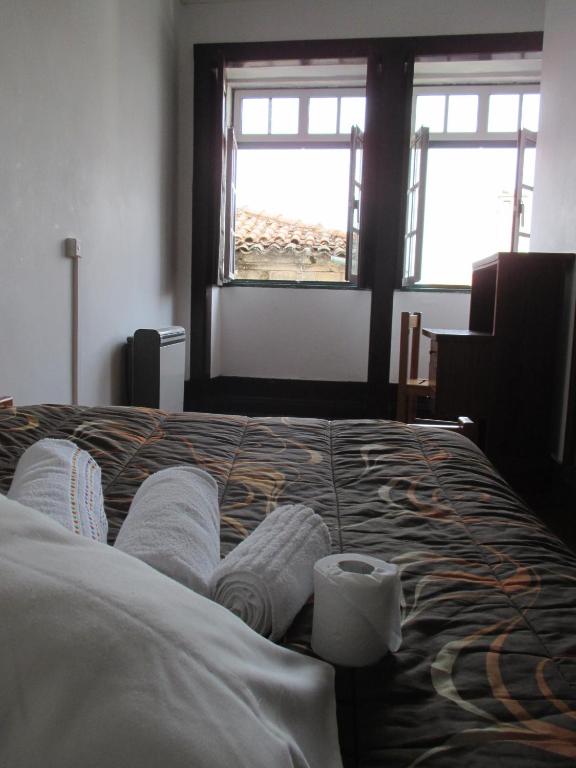 Postel nebo postele na pokoji v ubytování Guesthouse da Sé