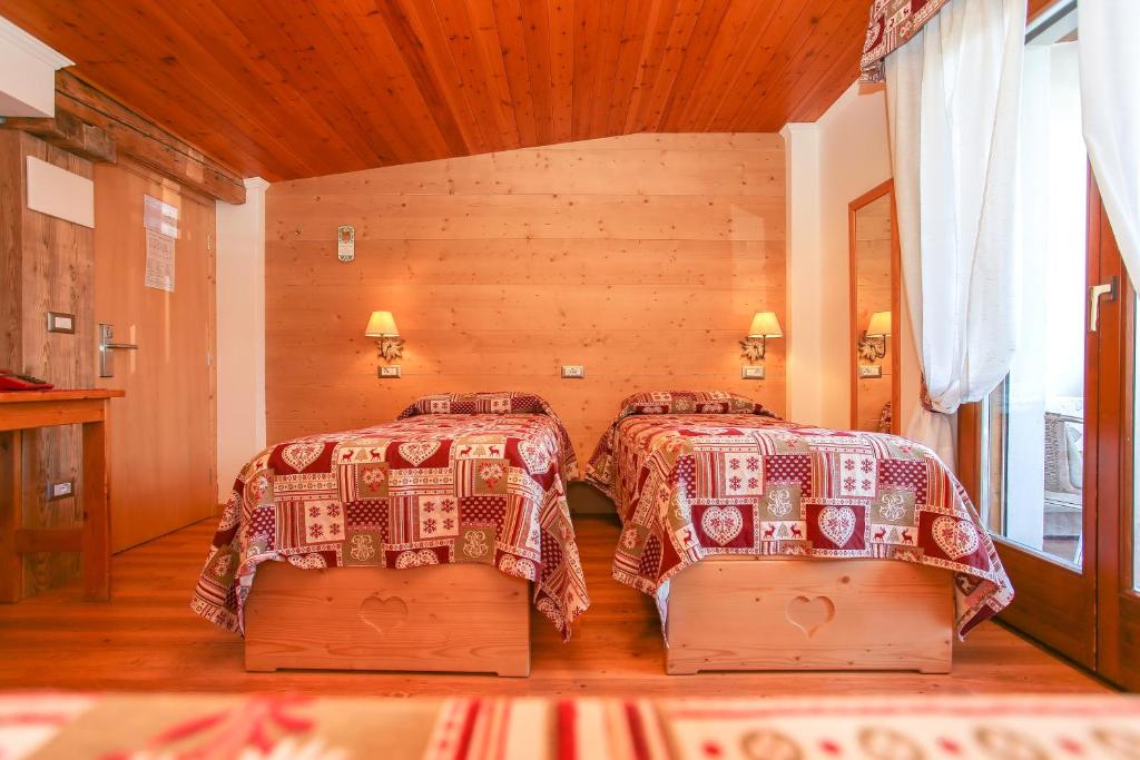 Postel nebo postele na pokoji v ubytování Albergo Adele