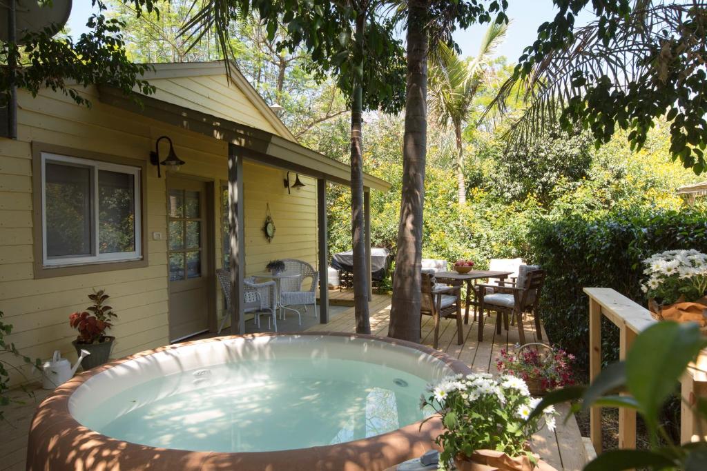 a hot tub in the backyard of a house at Beit Ram Sherf in Moshav Ramot