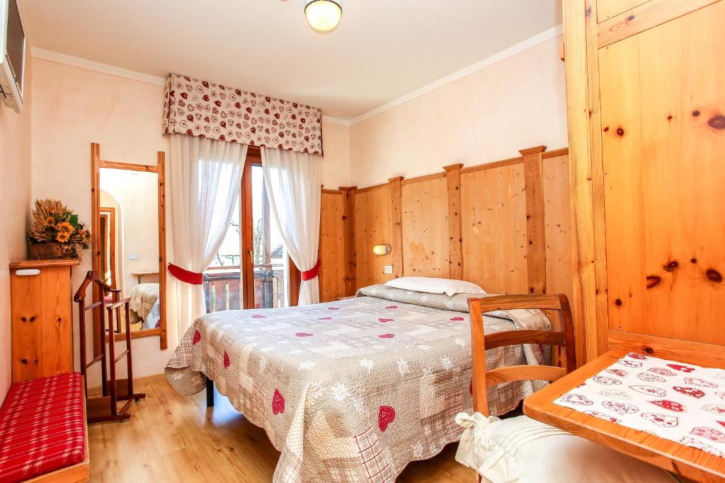 Postel nebo postele na pokoji v ubytování Albergo Adele