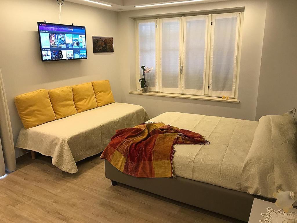 TV a/nebo společenská místnost v ubytování Casa Soave B&B