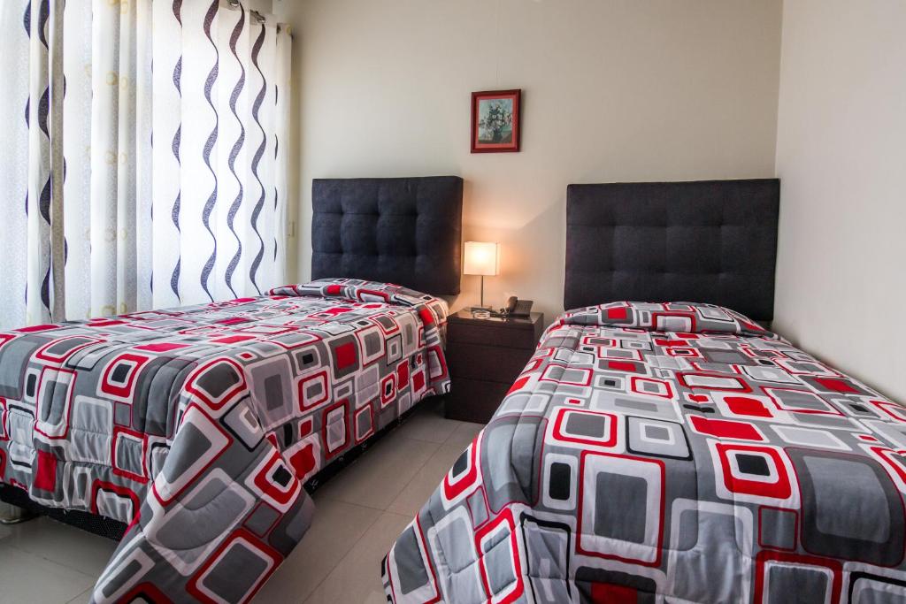 Postel nebo postele na pokoji v ubytování Hotel El Sol