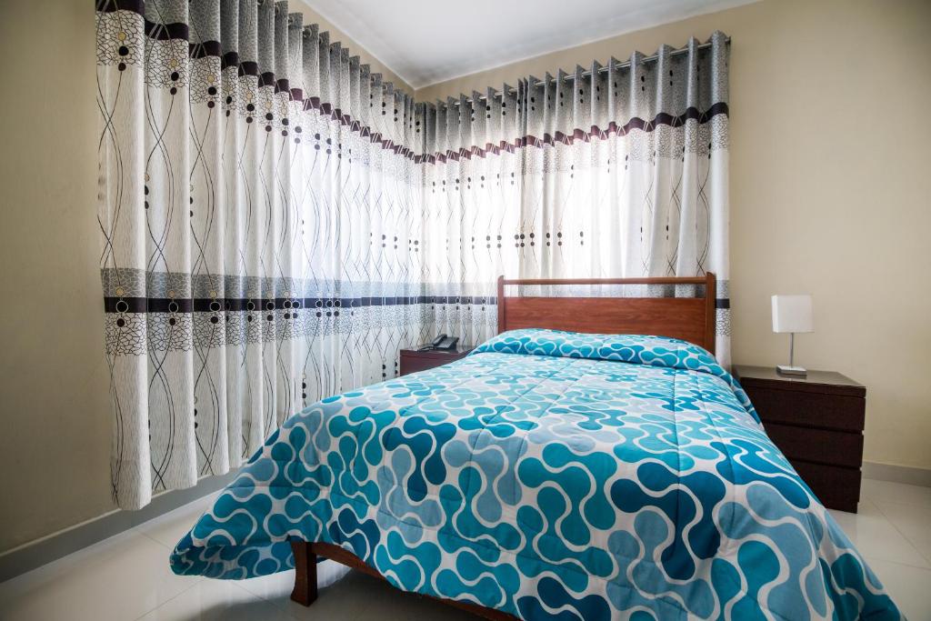Postel nebo postele na pokoji v ubytování Hotel El Sol