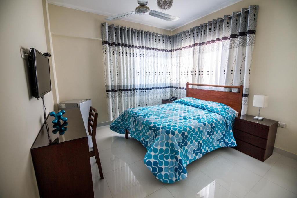 Postel nebo postele na pokoji v ubytování Hotel El Sol