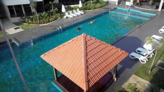 an overhead view of a large swimming pool at Samsuria Beach Apartment in Kuantan