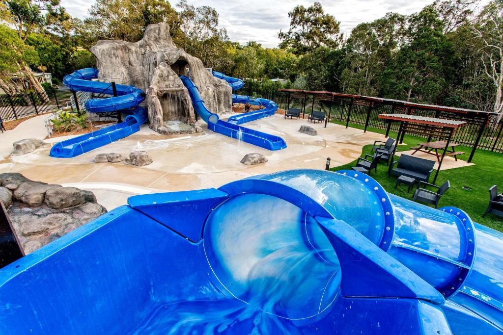 a water park with a blue water slide at BIG4 Tweed Billabong Holiday Park in Tweed Heads