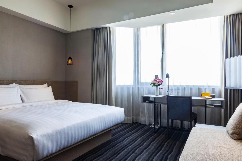 Postel nebo postele na pokoji v ubytování Changyu Hotel