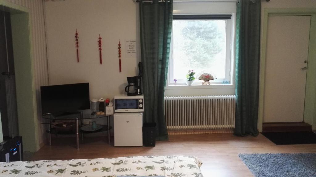 TV a/nebo společenská místnost v ubytování Lin's B&B