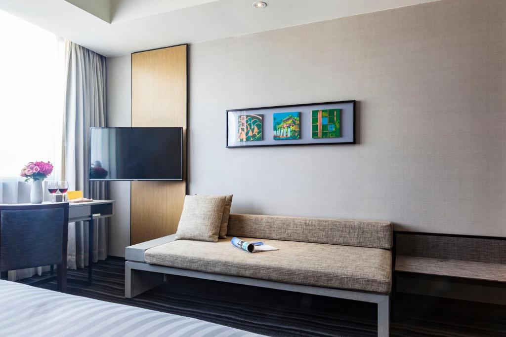 Postel nebo postele na pokoji v ubytování Changyu Hotel