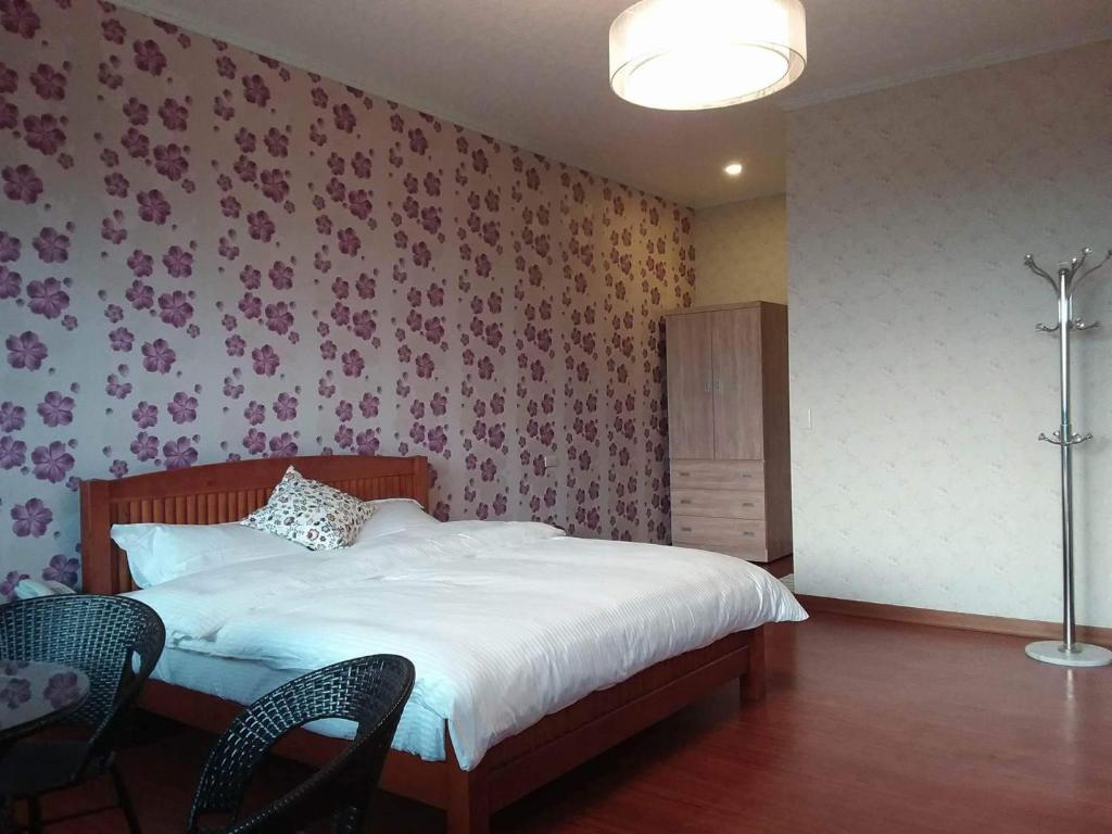 Postel nebo postele na pokoji v ubytování Chi House