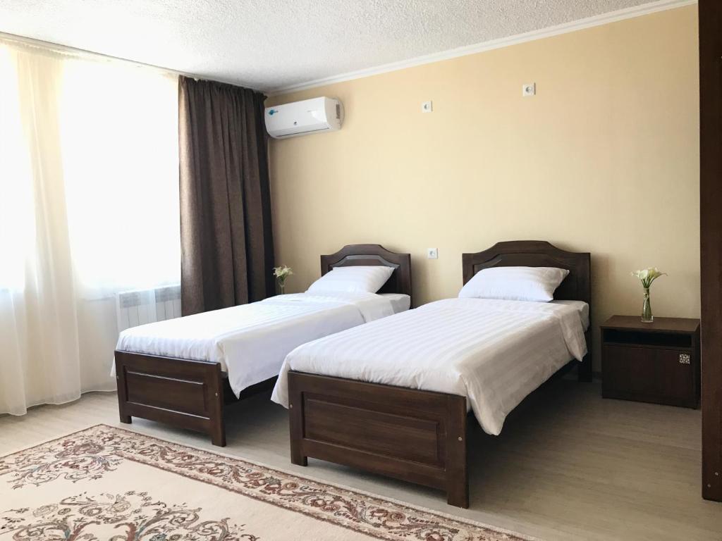 Postel nebo postele na pokoji v ubytování Nomad Hotel