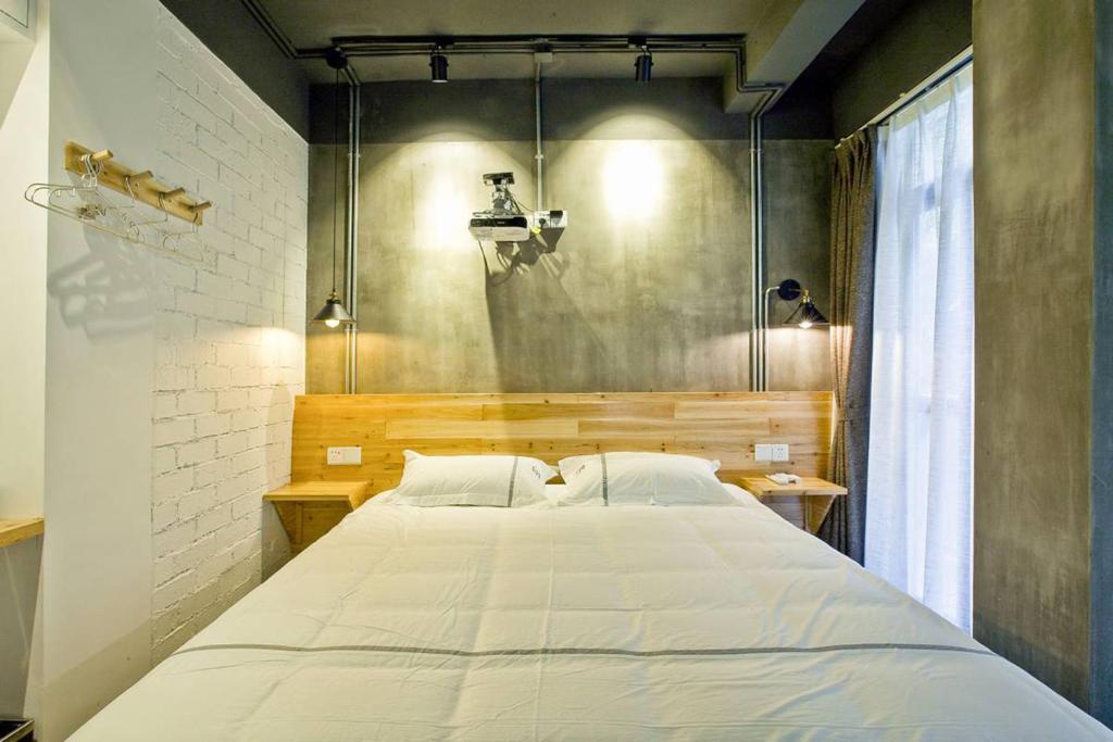 Postel nebo postele na pokoji v ubytování 0517 Boutique Hotel