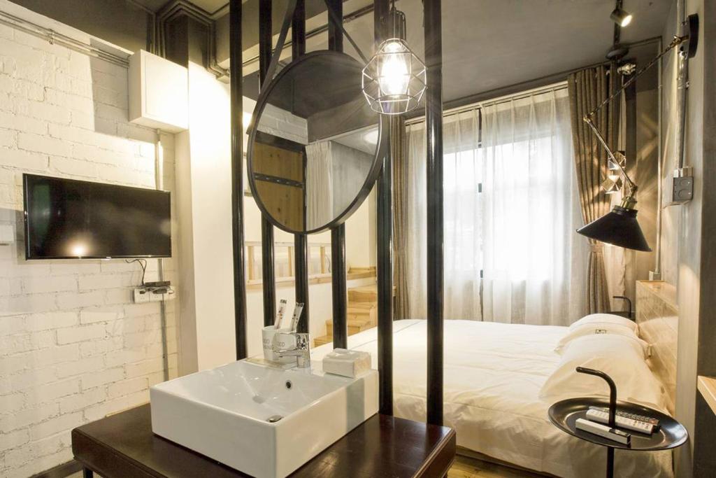 Postel nebo postele na pokoji v ubytování 0517 Boutique Hotel