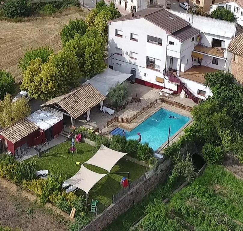 an aerial view of a house with a swimming pool at Casa Trillo Apartamentos in Torres del Obispo